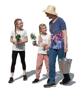 grandmother and grandchildren doing gardening work