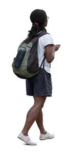 black woman with a backpack walking