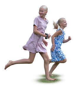 two girls running barefoot in the garden