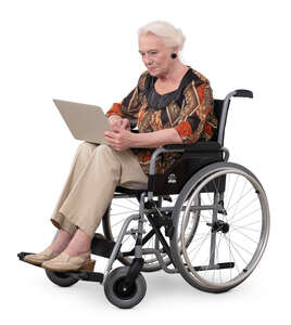 elderly lady with a laptop sitting in a wheel chair