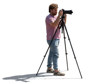 backlit man with a photo camera standing