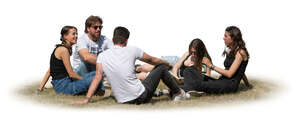 group of young people sitting outside on the grass