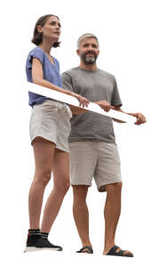 man and woman standing up on a balcony