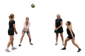 group of women playing volleyball