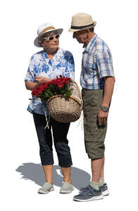 elderly couple with a basket of flowers standing