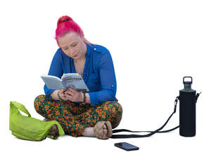 woman sitting on the floor and reading