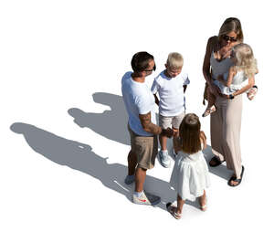 family with many kids standing outside in summer