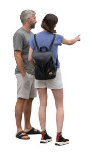 man and woman standing and selecting smth on touch screen