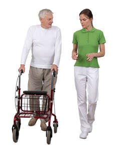 elderly man with a walking frame talking to a medical worker