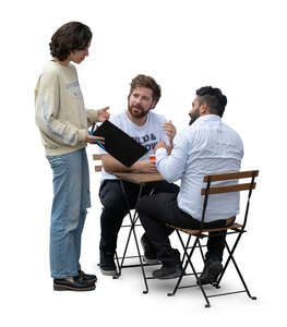 two men sitting in a cafe and talking to a waitress