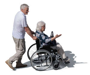 top view of a man pushing a woman in a wheelchair