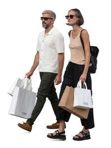 man and woman with shopping bags walking
