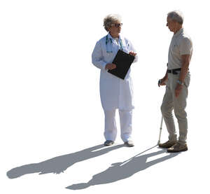 backlit doctor talking to an elderly male patient