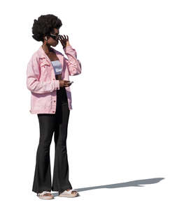 african woman with a pink jacket standing