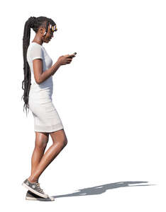 black woman in a white dress walking