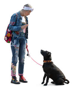 woman standing and talking to her dog