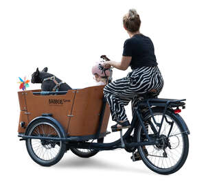 woman riding a cargo bike with a little girl and a dog sitting in the box