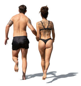 man and woman running on the beach