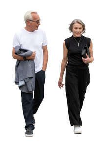 grey haired couple walking