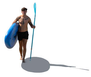 man with a paddle board walking on the beach