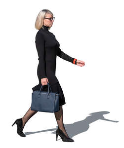 woman in a black dress and high heels walking