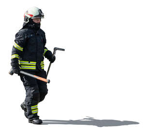 firefighter carrying tools walking