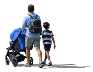 man walking pushing a stroller and holding his son by the hand