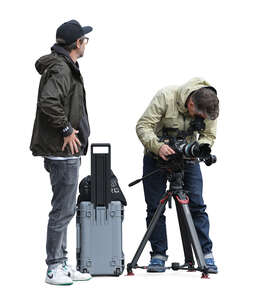 two men setting up a tripod with photo camera