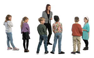 group of children standing and listening to their teacher