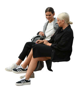 two women sitting and talking