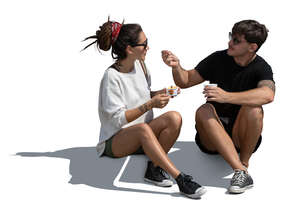 man and woman sitting and eating ice cream