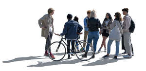 backlit group of teenagers standing