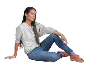 woman sitting casually on the ground