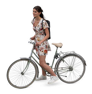 top view of a woman in a dress stopping on a bicycle