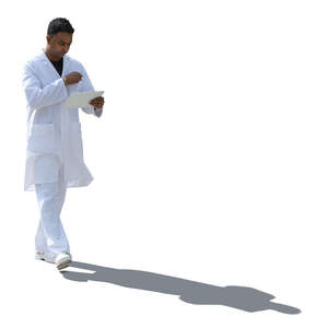 backlit indian doctor walking