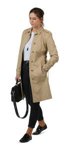 woman in a trenchcoat walking