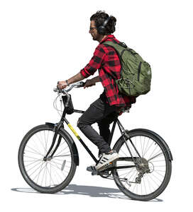 man with a backpack and headphones riding a bike