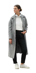 woman in a grey overcoat standing