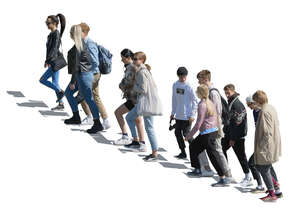 group of teenagers walking up the stairs