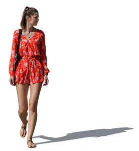 woman in a red summer dress walking