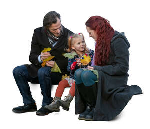 family in autumn sitting and talking