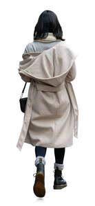 woman in a white hooded autumn coat walking