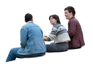 group of three young people sitting and talking