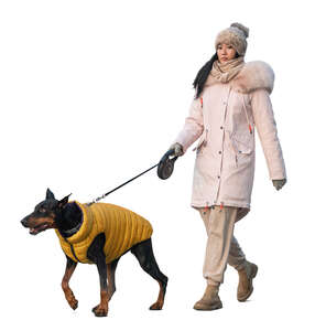woman in winter walking her dog