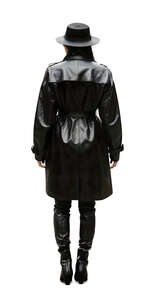 woman in a black leather coat standing