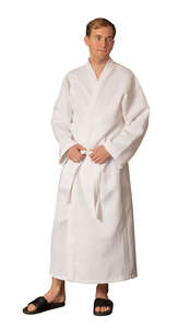 man in a white spa bathrobe standing