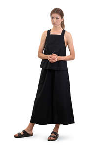 asian in black dress standing