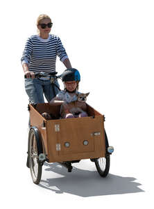woman riding a cargo bike and her daughter sitting in the box with her dog