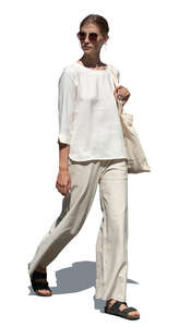 woman in relaxed white clothing walking