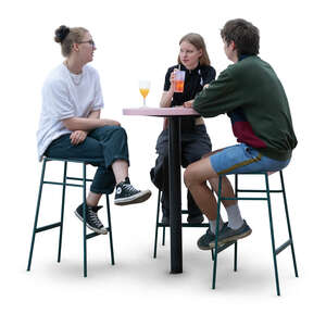 group of three people sitting at the bar and talking
